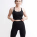 Set Original by Gymtuned în negru – bustieră sport pentru fitness si sala și colanți modelatori seamless fără cusături, purtate de model.